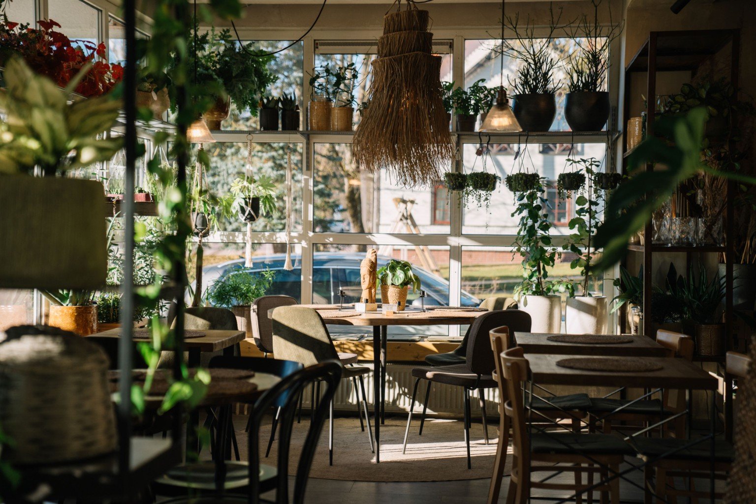 Plant-filled interior at Pievos in Birštonas