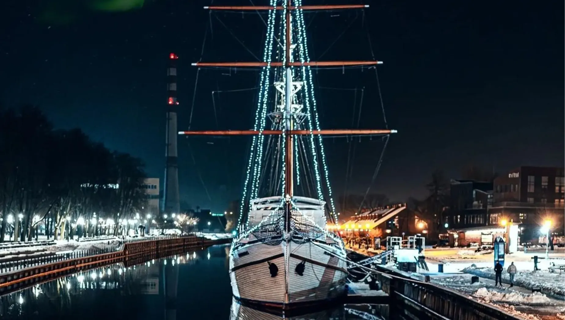 Meridianas sailing ship illuminated at night on the Danė River in Klaipėda