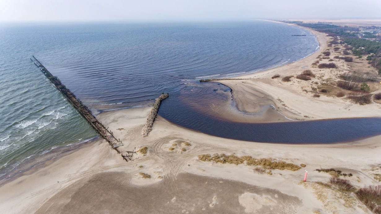 Aerial view of the Šventoji River mouth meeting the Baltic Sea